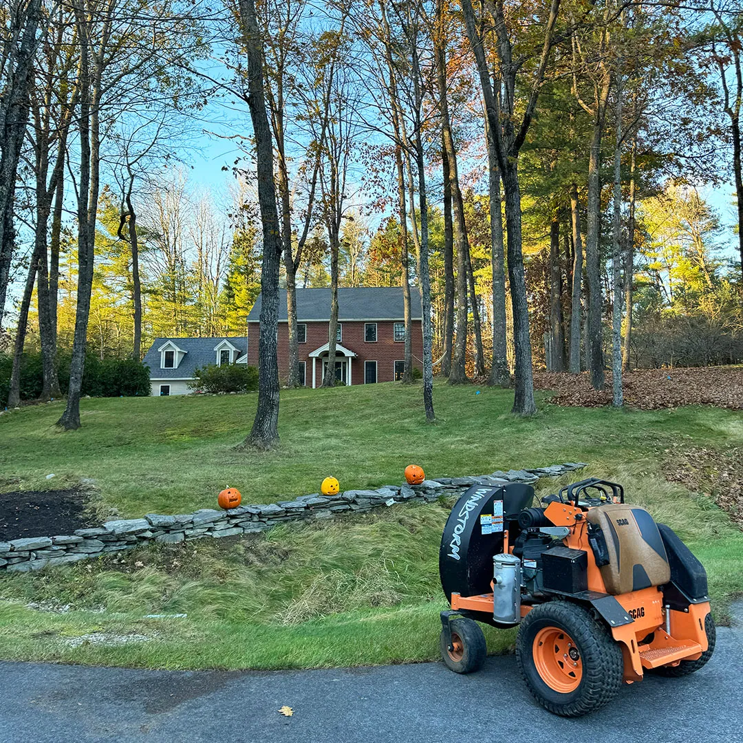 Picture of a large commercial leaf blower doing leaf and fall cleanup service near me